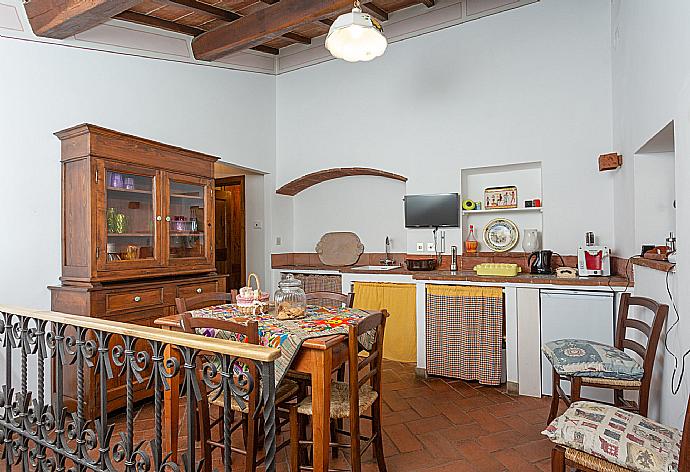 Dining room with kitchenette on first floor of main building . - Villa Casale Silvia . (Галерея фотографий) }}