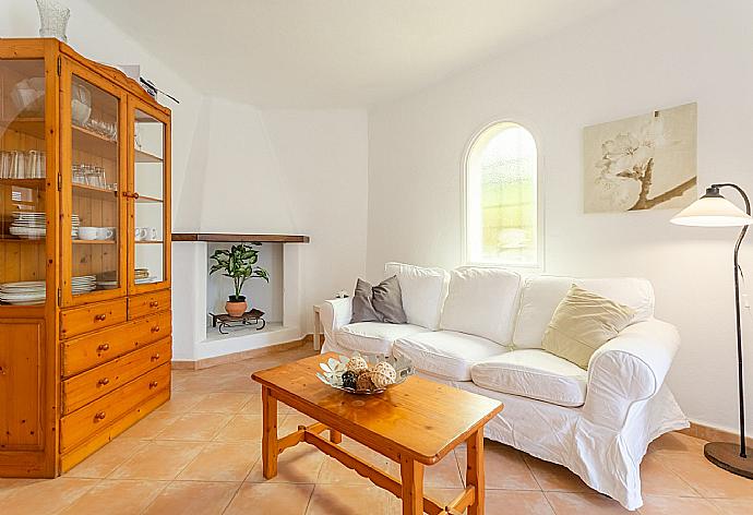 Open-plan living room with sofas, dining area, kitchen, ornamental fireplace, WiFi internet, satellite TV, DVD player, and terrace access . - Villa Corb Mari . (Galería de imágenes) }}