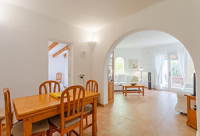 Open-plan living room with sofas, dining area, kitchen, ornamental fireplace, WiFi internet, satellite TV, DVD player, and terrace access . - Villa Corb Mari . (Galleria fotografica) }}