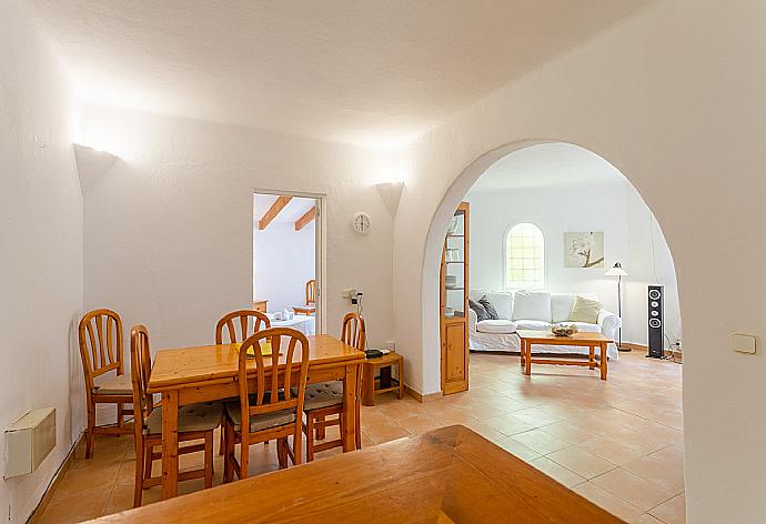 Open-plan living room with sofas, dining area, kitchen, ornamental fireplace, WiFi internet, satellite TV, DVD player, and terrace access . - Villa Corb Mari . (Galería de imágenes) }}