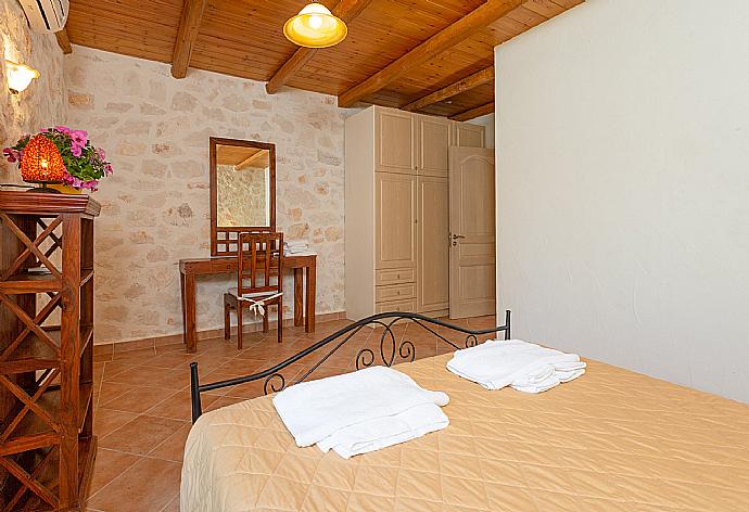 Double bedroom with en suite bathroom, A/C, and terrace access . - Villa Diony . (Photo Gallery) }}