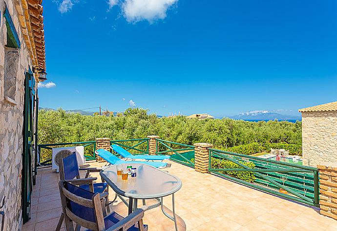 Upper terrace area with sea views . - Villa Diony . (Photo Gallery) }}
