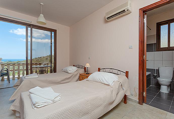 Twin bedroom with en suite bathroom, A/C, and terrace access with panoramic views of the sea and countryside . - Villa Rallo . (Photo Gallery) }}