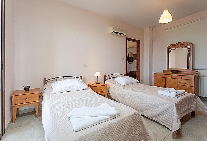 Twin bedroom with en suite bathroom, A/C, and terrace access with panoramic views of the sea and countryside . - Villa Rallo . (Photo Gallery) }}