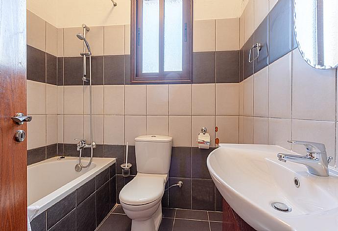 En suite bathroom with bath and shower . - Villa Rallo . (Photo Gallery) }}