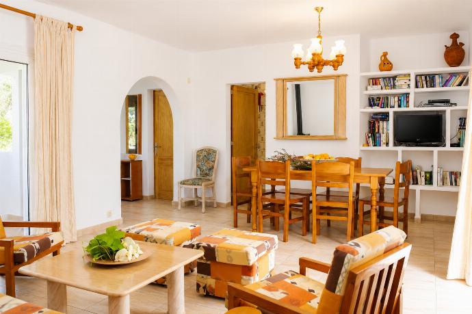 Living room with sofas, and dining area . - Villa Roca Nova . (Photo Gallery) }}