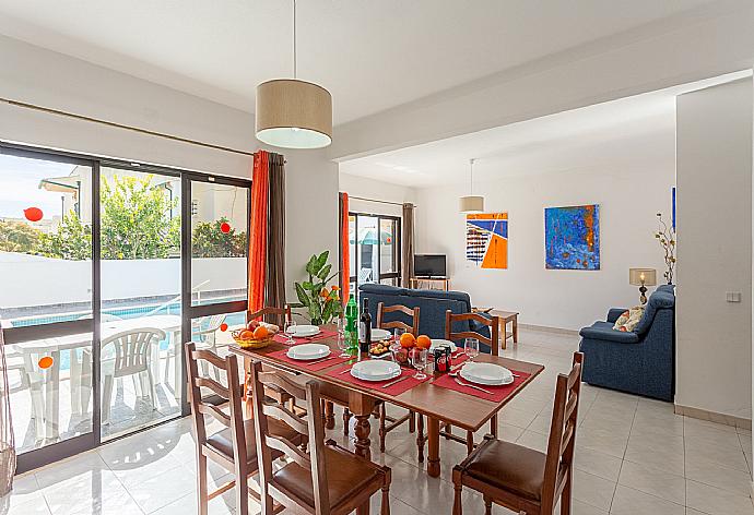 Living room with sofas, dining area, WiFi internet, satellite TV, DVD player, and pool terrace access . - Villa Lumiere . (Fotogalerie) }}