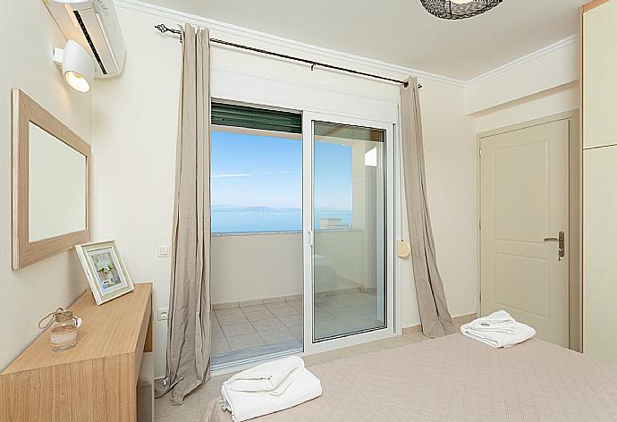Double bedroom with A/C and balcony access with panoramic sea views . - Akti Barbati Villa Ena . (Photo Gallery) }}