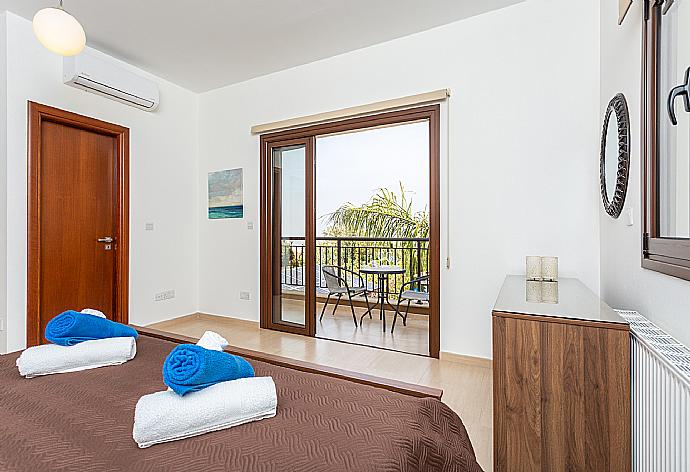 Double bedroom with en suite bathroom, A/C, and balcony access . - Villa Kalizoni . (Photo Gallery) }}