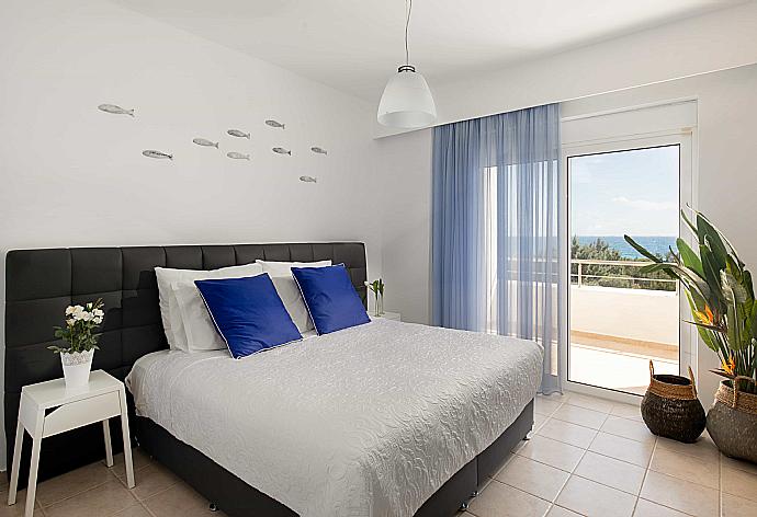 Double bedroom with A/C and balcony access  . - Villa Mediterranean Blue . (Photo Gallery) }}