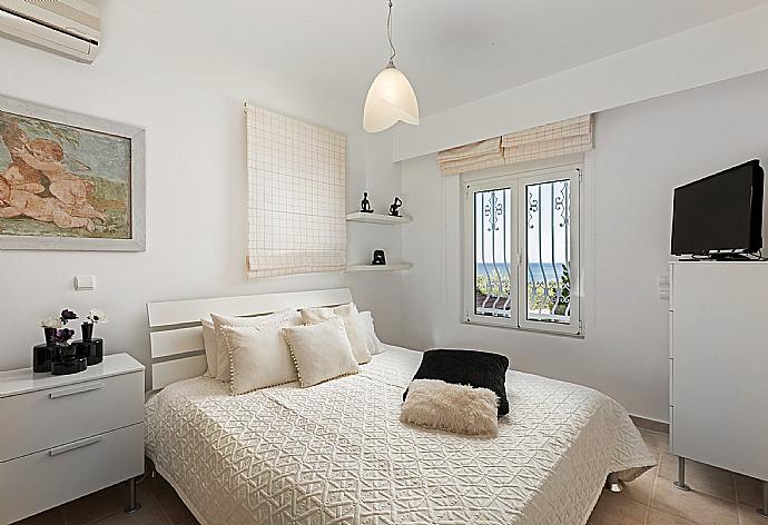 Double bedroom with A/C  . - Villa Pelagos Blue . (Photo Gallery) }}