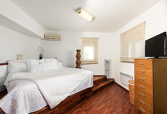 Double bedroom with A/C and balcony access . - Villa Pelagos Blue . (Photo Gallery) }}