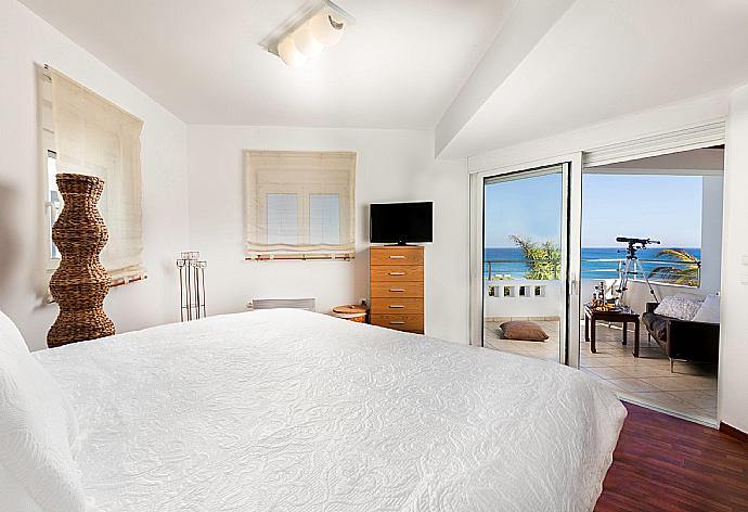 Double bedroom with A/C and balcony access . - Villa Pelagos Blue . (Photo Gallery) }}