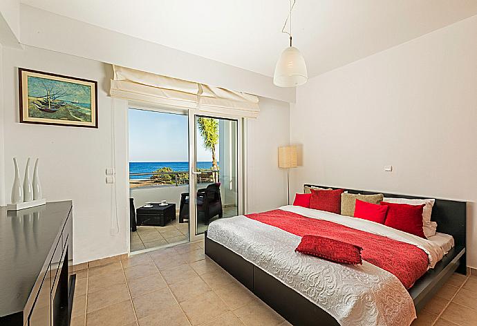 Double bedroom with A/C and balcony access . - Villa Pelagos Blue . (Photo Gallery) }}