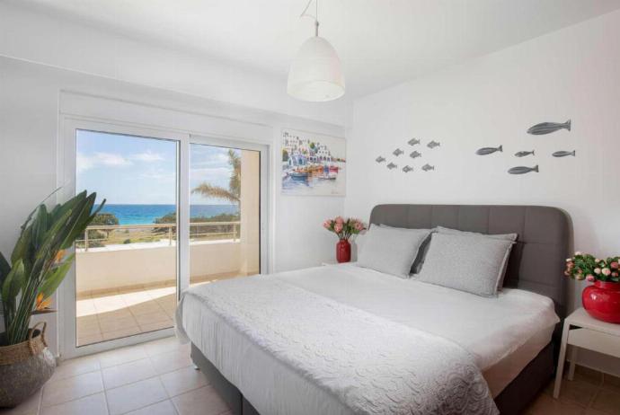 Double bedroom with A/C and balcony access . - Villa Pelagos Blue . (Photo Gallery) }}