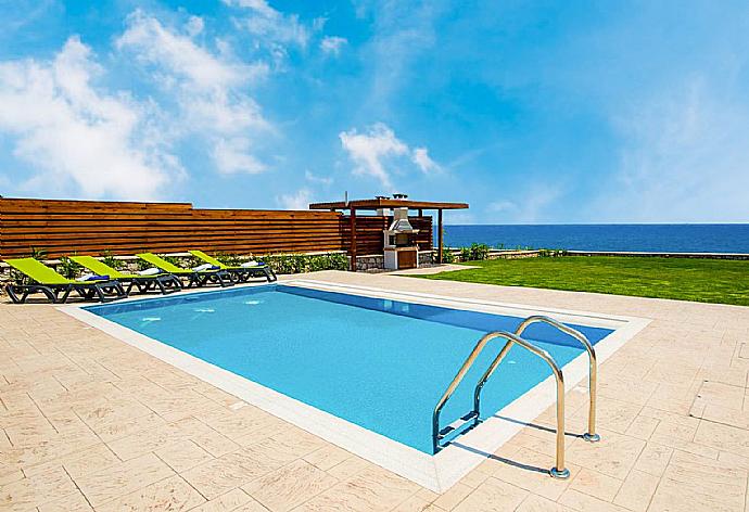 Private pool, terrace, and lawn with panoramic sea views . - Villa Metis . (Photo Gallery) }}