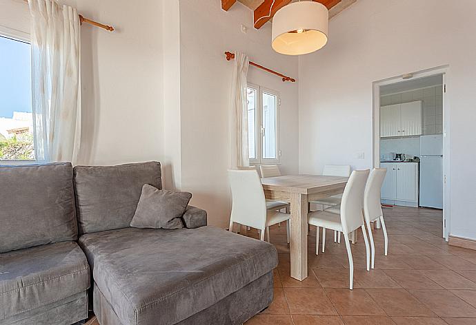 Living room with sofa, dining area, ornamental fireplace, WiFi internet, satellite TV, DVD player, and terrace access with sea views . - Villa Concha . (Fotogalerie) }}