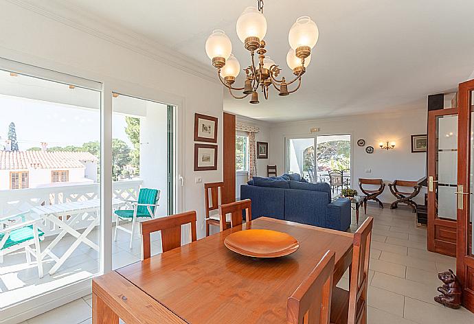 Living room with sofas, dining area, ornamental fireplace, WiFi internet, satellite TV, DVD player, and balcony access . - Villa Luisa . (Fotogalerie) }}