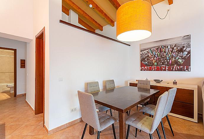 Living room with sofas, dining area, ornamental fireplace, WiFi internet, satellite TV, DVD player, and terrace access . - Villa Casa Xaloc . (Fotogalerie) }}