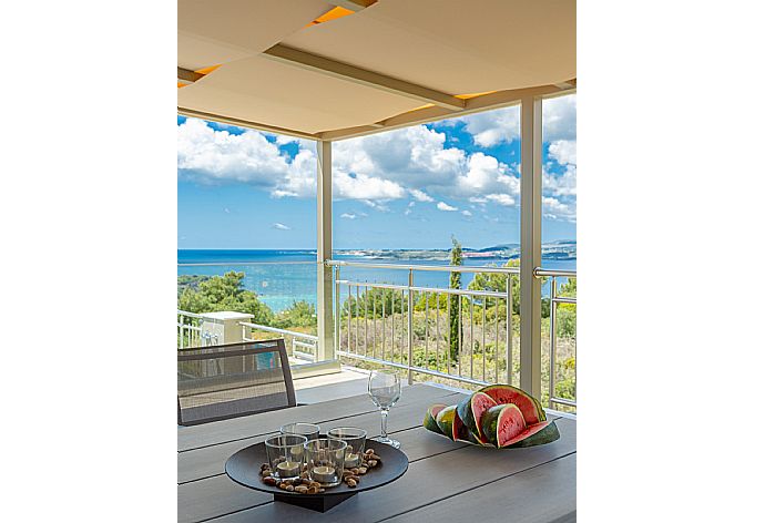 Outdoor dining area with beautiful view . - Villa Lassi Fos . (Photo Gallery) }}