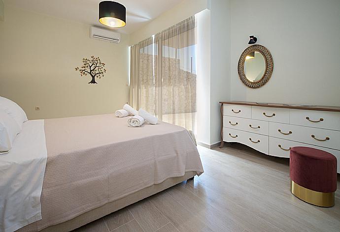 Double bedroom with  beautiful view and terrace access . - Villa Lassi Fos . (Photo Gallery) }}