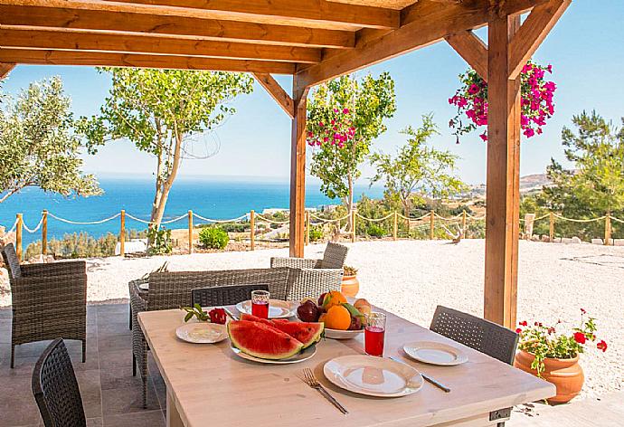 Sheltered terrace area with sea views . - Villa Paradiso Sunset . (Photo Gallery) }}