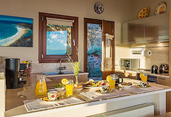 Equipped kitchen with dining area  . - Villa Diona . (Photo Gallery) }}