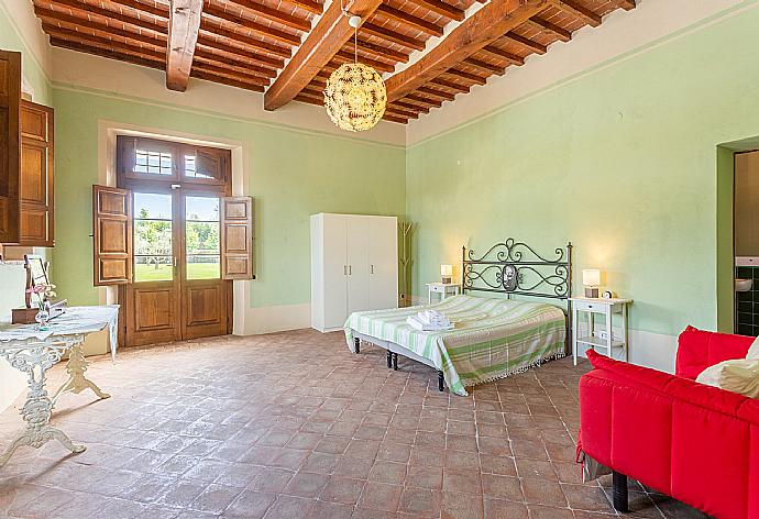 Double bedroom on ground floor with en suite bathroom and terrace access . - Villa Rossa . (Photo Gallery) }}