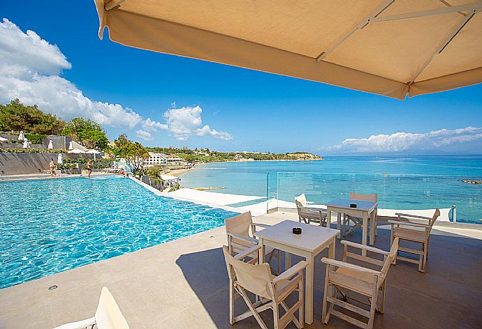 Restaurant and pool at Sentido Alexandra Beach Resort . - Apartment Casalma Thio . (Галерея фотографий) }}