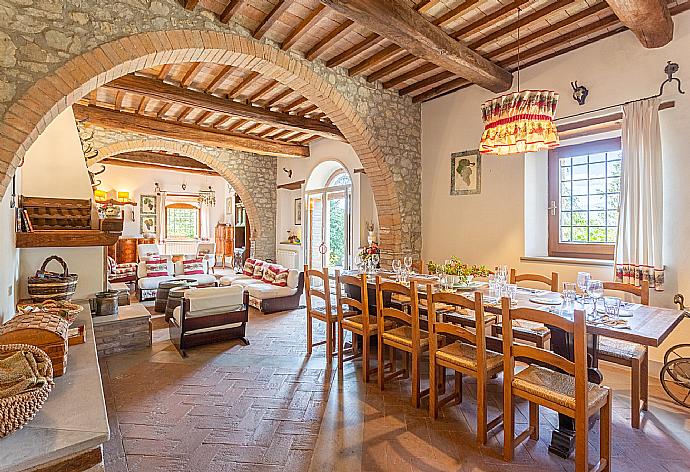 Living room on ground floor with sofas, dining area, ornamental fireplace, WiFi internet, satellite TV, and terrace access . - Villa Il Giulione . (Галерея фотографий) }}