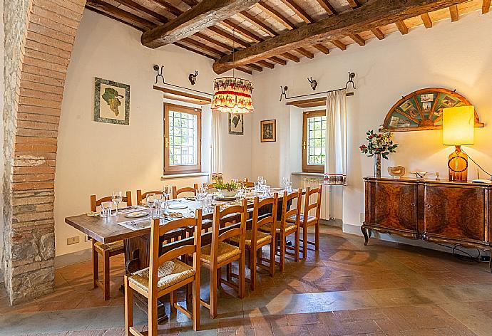 Living room on ground floor with sofas, dining area, ornamental fireplace, WiFi internet, satellite TV, and terrace access . - Villa Il Giulione . (Galleria fotografica) }}