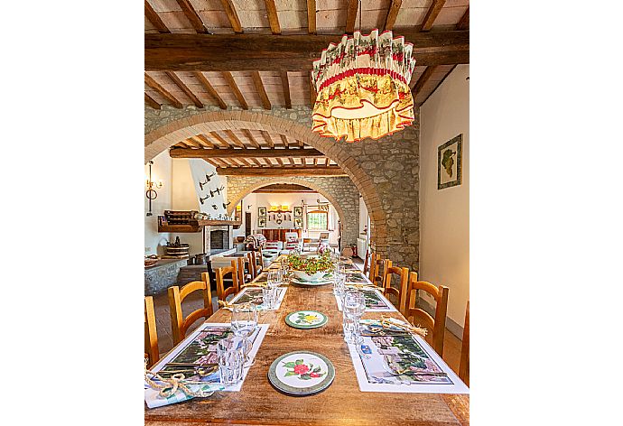 Living room on ground floor with sofas, dining area, ornamental fireplace, WiFi internet, satellite TV, and terrace access . - Villa Il Giulione . (Galleria fotografica) }}