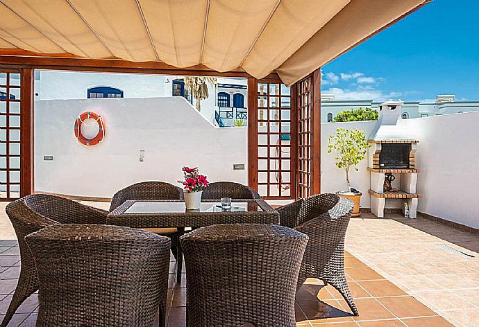 Outdoor sheltered patio . - Villa Bellamar . (Галерея фотографий) }}