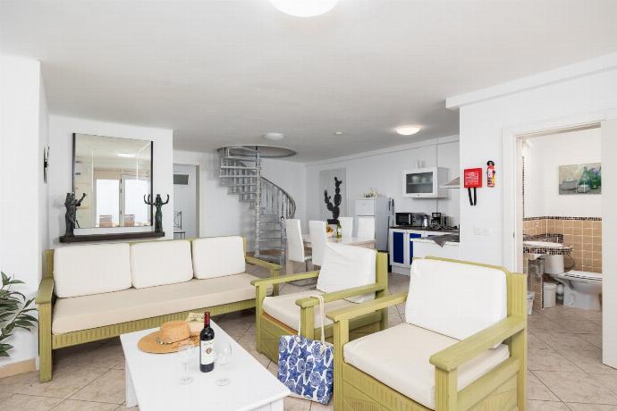 Unit 2: open-plan living room with sofa, dining area, kitchen, A/C, WiFi internet, satellite TV, and sea views . - Villa Oasis de Asomada . (Galería de imágenes) }}