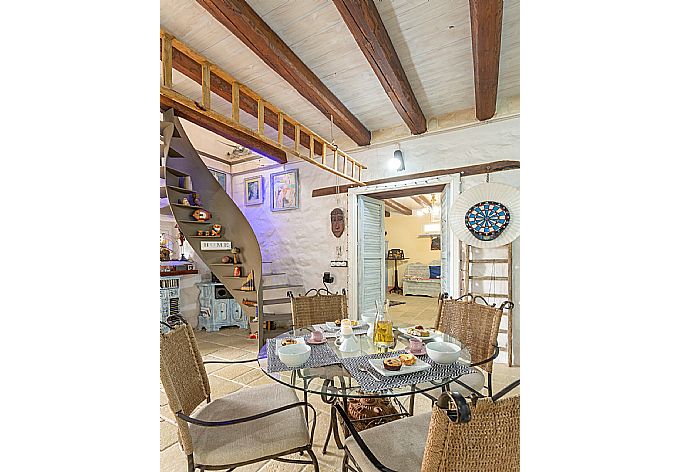 Living room with sofas, dining area, ornamental fireplace, WiFi internet, satellite TV, and terrace access . - Villa Nina . (Photo Gallery) }}