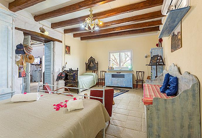 Double bedroom with extra single bed and A/C . - Villa Nina . (Photo Gallery) }}