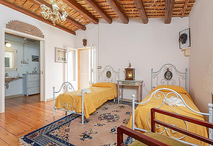 Twin bedroom with en suite bathroom and balcony access . - Villa Nina . (Photo Gallery) }}