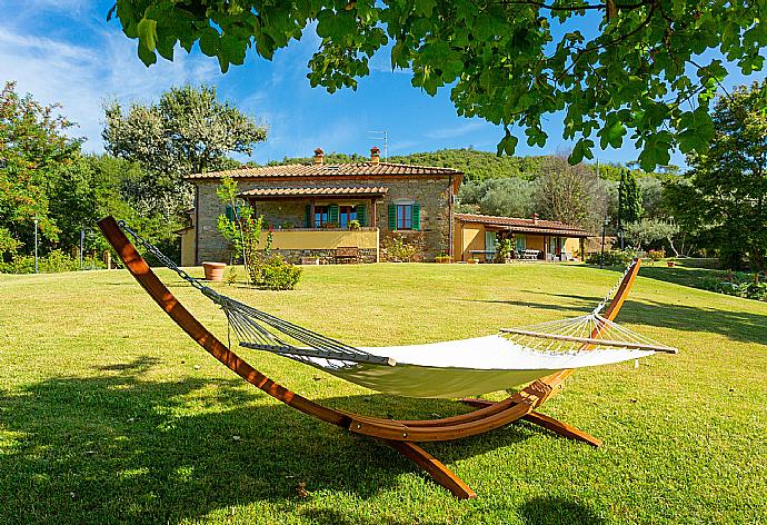 Garden area with hammock . - Villa Casale Federica . (Photo Gallery) }}