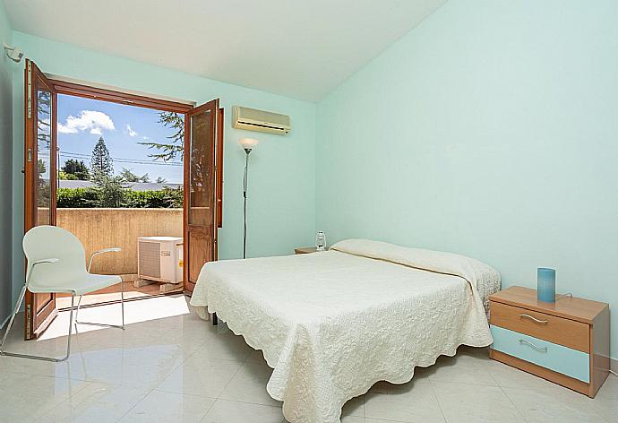 Double bedroom with A/C and balcony access . - Villa Venere . (Photo Gallery) }}