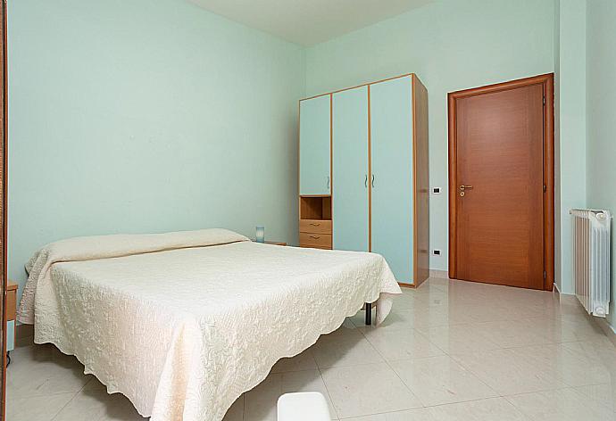 Double bedroom with A/C and balcony access . - Villa Venere . (Photo Gallery) }}