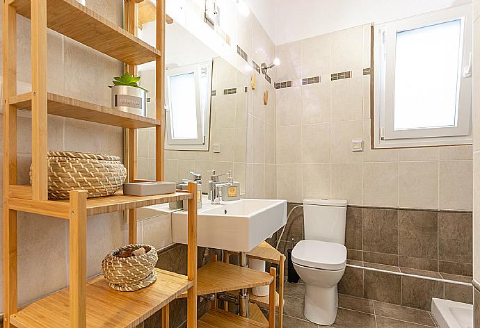 Family bathroom on first floor with shower . - Villa Amarandos . (Photo Gallery) }}