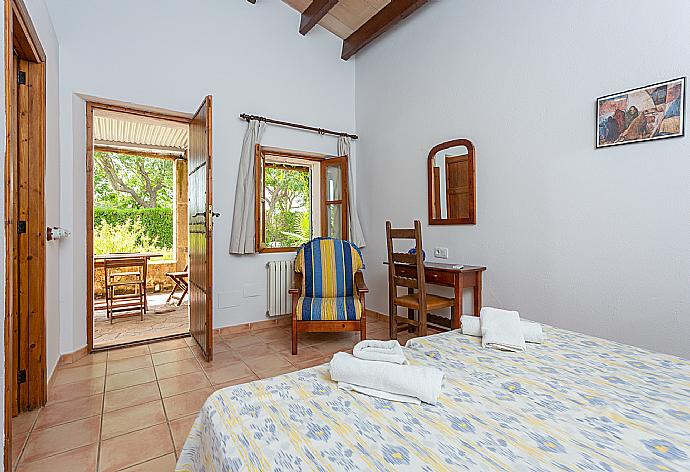 Twin bedroom in annex with en suite bathroom, A/C, and terrace access . - Villa Can Soler I . (Photo Gallery) }}