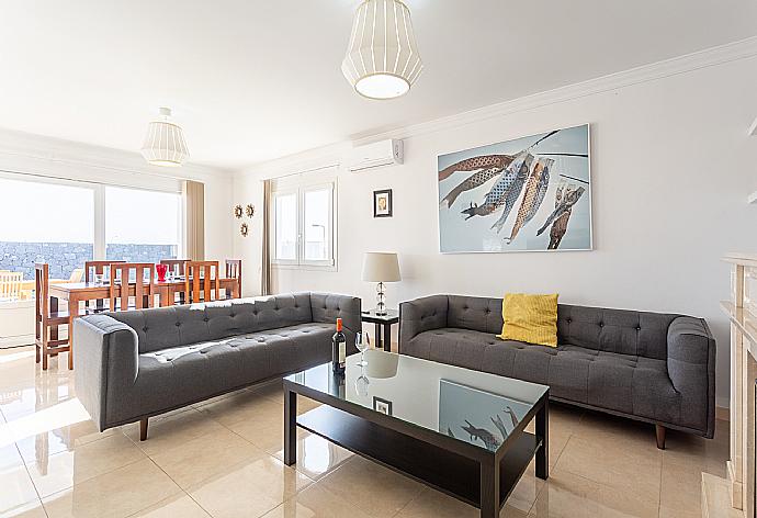 Living room with sofas, dining area, ornamental fireplace, A/C, WiFi internet, and satellite TV . - Villa Diego . (Fotogalerie) }}