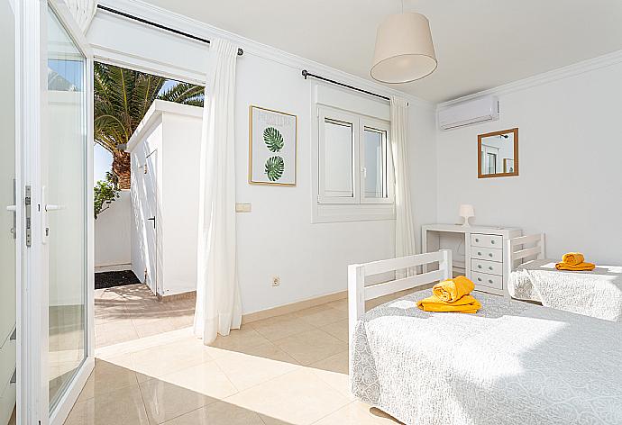 Twin bedroom with A/C and terrace access . - Villa Diego . (Photo Gallery) }}