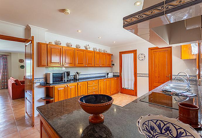 Equipped kitchen with dining area . - Villa Padilla . (Photo Gallery) }}