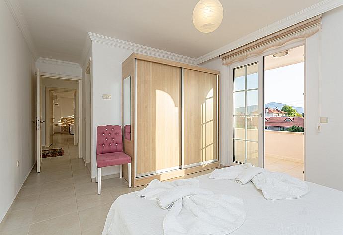 Double bedroom with en suite bathroom, A/C, and balcony access . - Villa Kubra . (Photo Gallery) }}