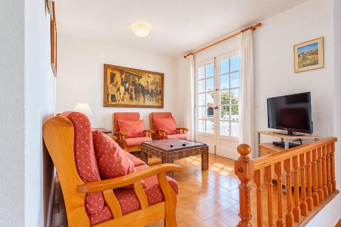 Open-plan living room with sofas, dining area, kitchen, WiFi internet, satellite TV