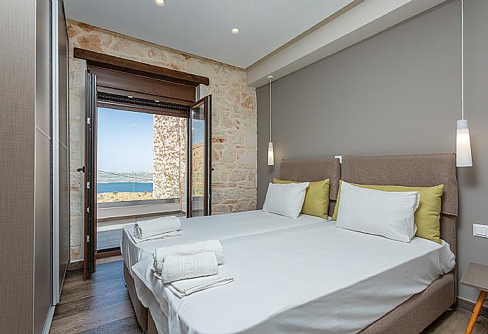 Twin bedroom with A/C and balcony access . - Villa Lulla . (Photo Gallery) }}