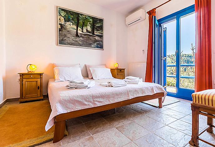 Double bedroom with A/C and balcony access. . - Villa Levanda . (Photo Gallery) }}