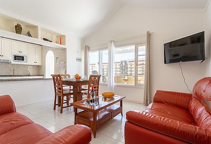 Open-plan living room with sofas, dining area, kitchen, A/C, WiFi internet, satellite TV, and terrace access . - Villa Zoe . (Fotogalerie) }}